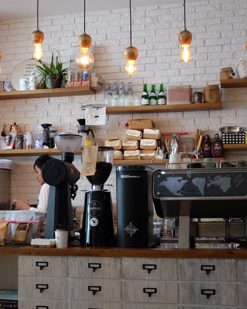 A Maple & Bean barista at work behind the espresso bar